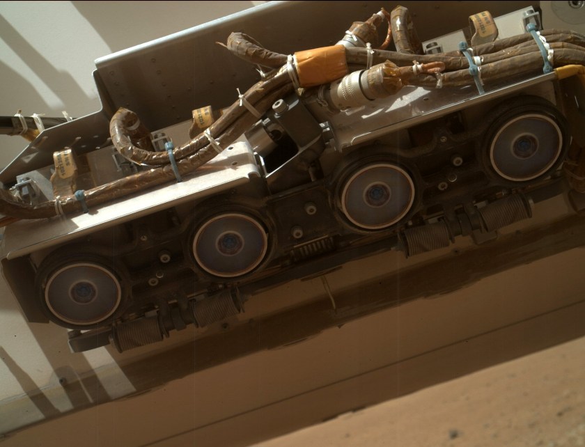 Curiosity's front Hazcams as imaged by the robotic arm-mounted MARDI camera. Credit: NASA/JPL-Caltech